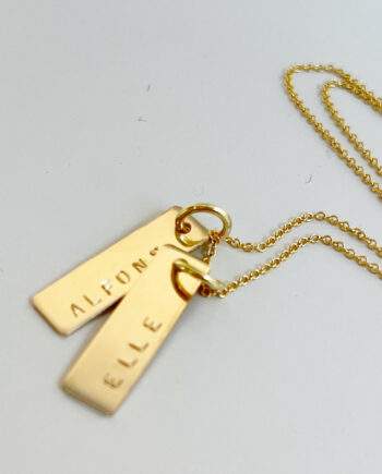 necklace with gold name tag