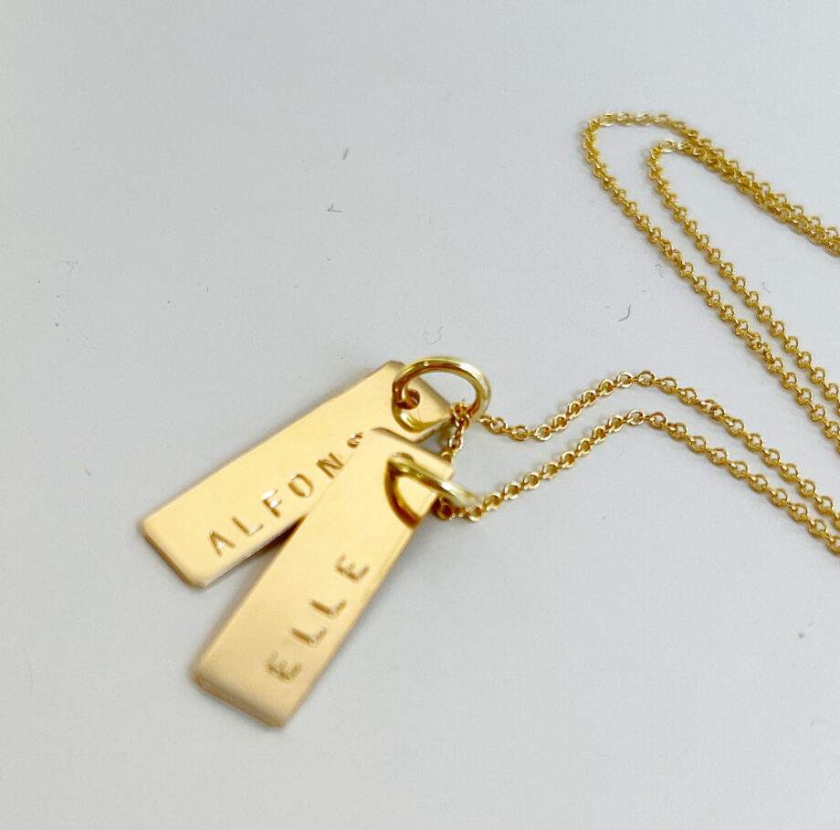 necklace with gold name tag
